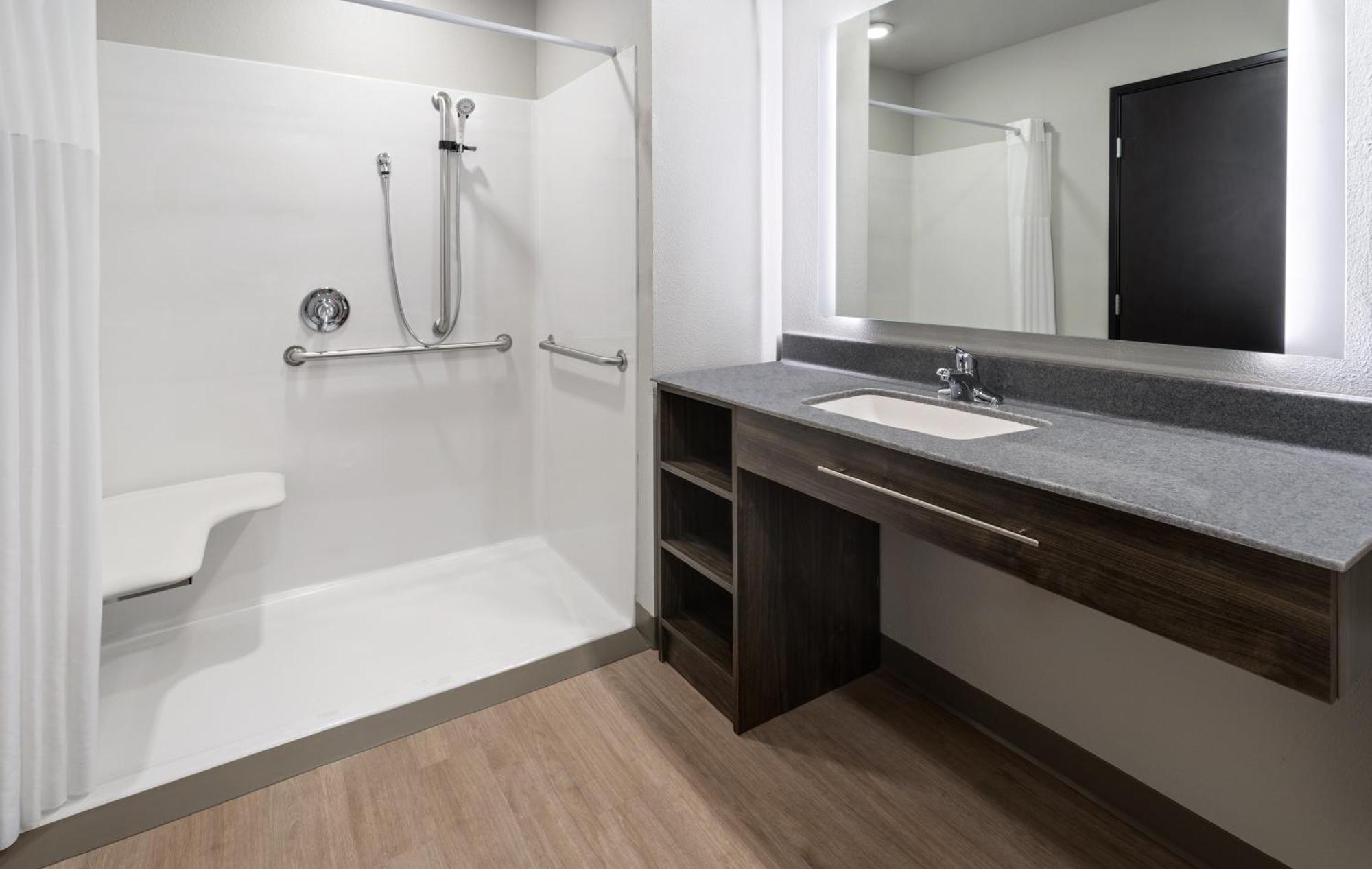 Queen Room Hearing & Mobility Accessible Roll Shower