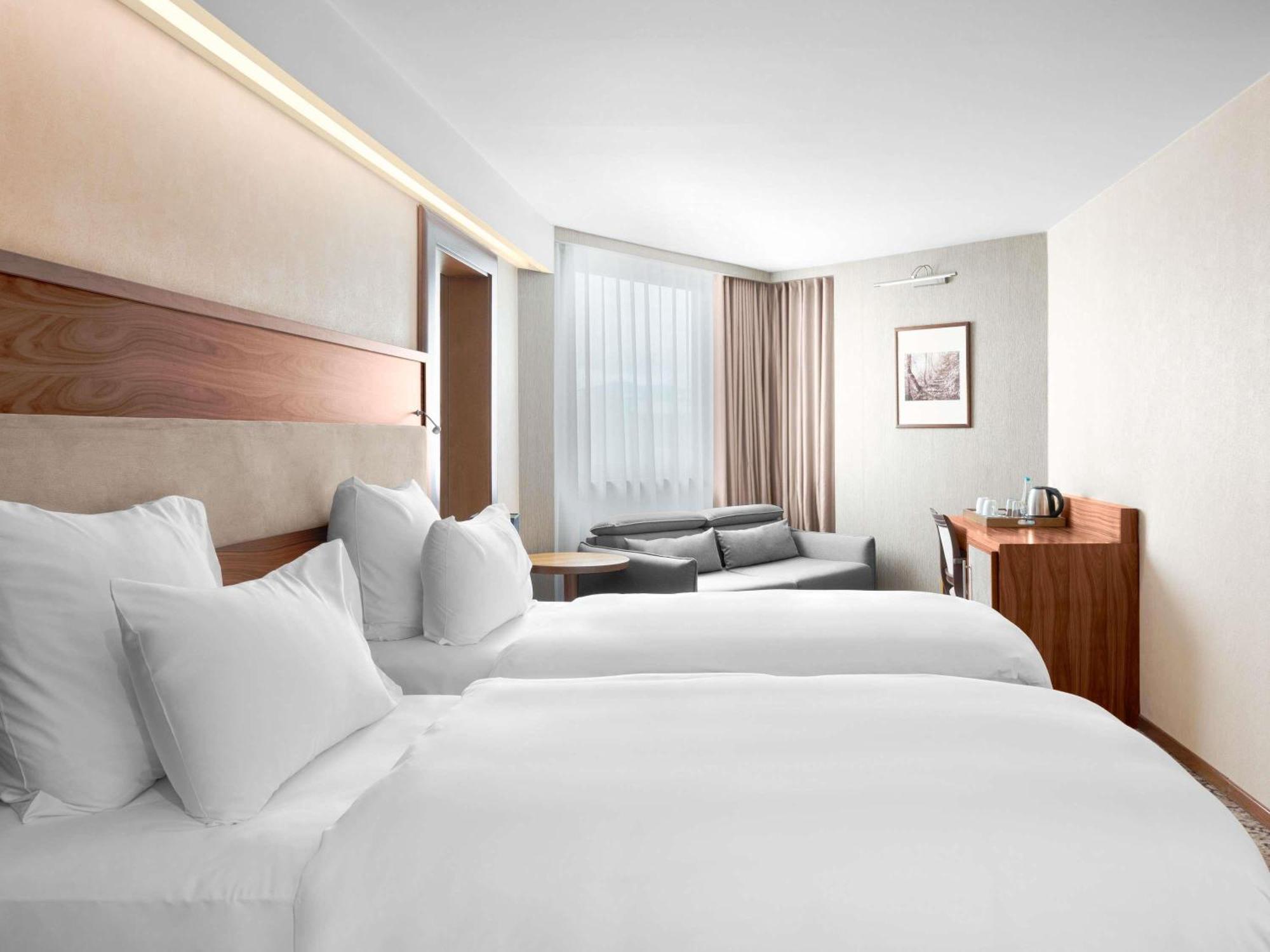 Deluxe Kamer met Kingsize Bed of 2 Aparte Bedden en Bank