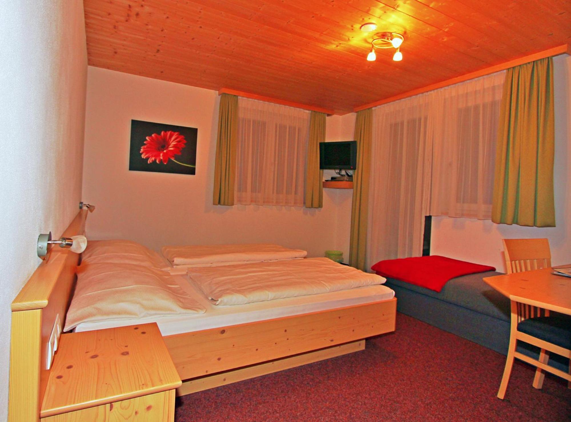 Dreibettzimmer mit Balkon